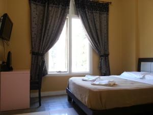 Postel nebo postele na pokoji v ubytování Central Private Hotel