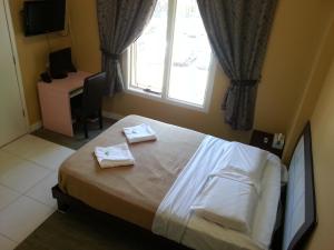 Postel nebo postele na pokoji v ubytování Central Private Hotel