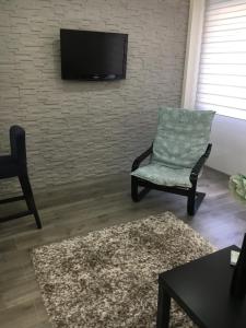 A seating area at Apartman Mercedes