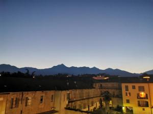 a view of a city with mountains in the background at In centro da Laura, Via Repubblica 49 BI in Biella