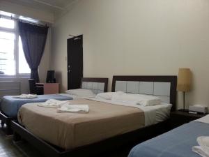Postel nebo postele na pokoji v ubytování Central Private Hotel