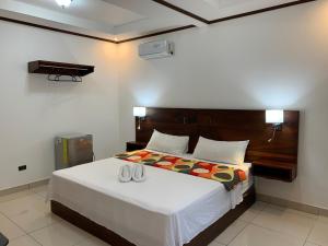 Postel nebo postele na pokoji v ubytování Hotel Manuel Antonio Park