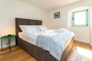 Łóżko lub łóżka w pokoju w obiekcie Holiday house DREAM