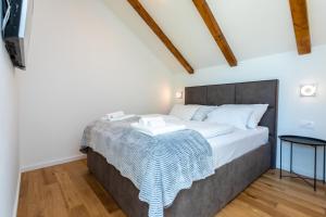 Łóżko lub łóżka w pokoju w obiekcie Holiday house DREAM