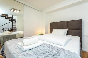 Łóżko lub łóżka w pokoju w obiekcie Holiday house DREAM