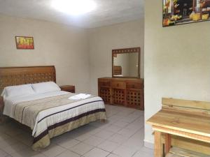 Postel nebo postele na pokoji v ubytování Hospedaje San Antonio Tepoztlán. + 37 fotografií