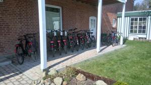 a group of bikes parked next to a brick building at Ferienwohnung 4 Familie Ramm in Eutin