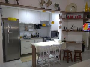 A kitchen or kitchenette at Loft Condado Aldeia dos Reis 216