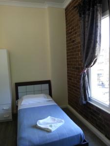 Postel nebo postele na pokoji v ubytování Central Private Hotel