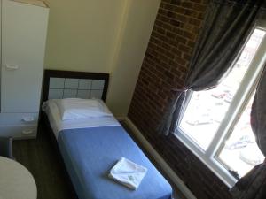 Postel nebo postele na pokoji v ubytování Central Private Hotel