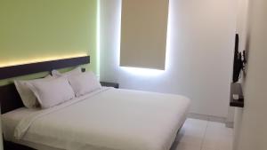 Voodi või voodid majutusasutuse V Hotel Tebet toas