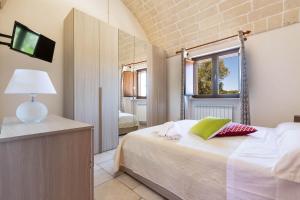 Posteľ alebo postele v izbe v ubytovaní Villa Ajeni by Perle di Puglia