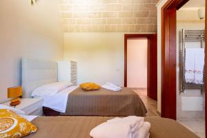 Posteľ alebo postele v izbe v ubytovaní Villa Ajeni by Perle di Puglia