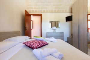 Posteľ alebo postele v izbe v ubytovaní Villa Ajeni by Perle di Puglia