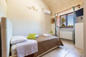 Posteľ alebo postele v izbe v ubytovaní Villa Ajeni by Perle di Puglia