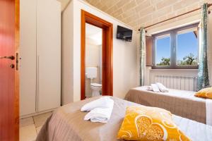 Posteľ alebo postele v izbe v ubytovaní Villa Ajeni by Perle di Puglia