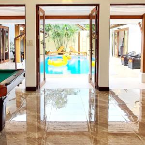 a pool with a rubber duck in a swimming pool at Orange palm pool villa in Koh Samui 