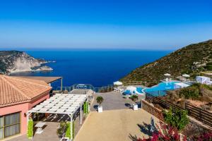 a view of the amalfi coast from a house at Petani Bay Hotel - Adults Only in Vóvikes