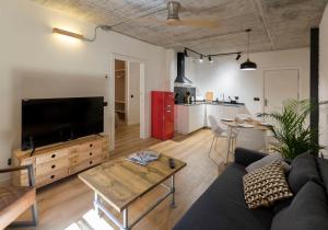 a living room with a couch and a table at ERASMUS PLAZA in Salamanca
