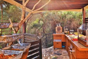 an outdoor kitchen with a table and baskets of food at Atalante Hotel in Kaş