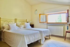 Postel nebo postele na pokoji v ubytování Casa GINESTRA a Bagno Vignoni