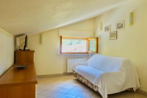 Llit o llits en una habitació de Casa GINESTRA a Bagno Vignoni