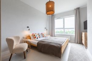 Posteľ alebo postele v izbe v ubytovaní Apartamenty Your Seaside
