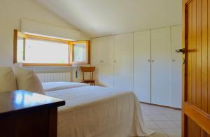 Llit o llits en una habitació de Casa GINESTRA a Bagno Vignoni