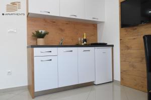 Kuchyň nebo kuchyňský kout v ubytování S-Apartmani Cocetova