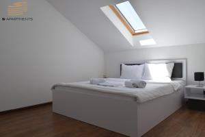 Postel nebo postele na pokoji v ubytování S-Apartmani Cocetova