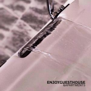 a close up of a glass object with water on it at Enjoy Guest House GMR in Guimarães