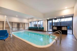 a large swimming pool with a slide in a building at La Quinta by Wyndham Glenwood Springs in Glenwood Springs