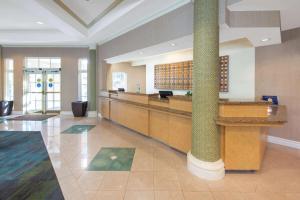 a lobby of a hospital with a check in counter at La Quinta by Wyndham Tampa Brandon Regency Park in Brandon