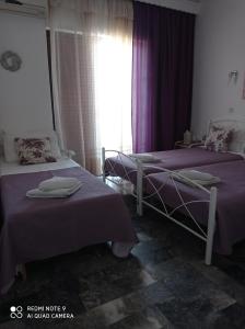 Кровать или кровати в номере Nancy Rooms