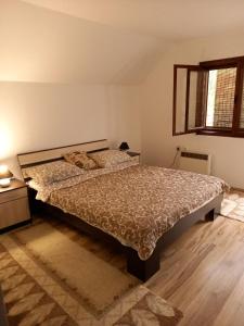 Postel nebo postele na pokoji v ubytování Apartment Sijakovic