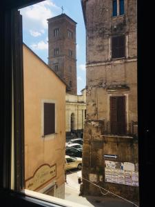 a view from a window of a building with a clock tower at Localetto bed & dinner in Sutri