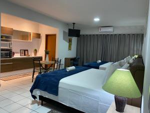 B & A Suites Inn Hotel - Quarto Luxo Safira客房内的一张或多张床位