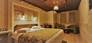 Postel nebo postele na pokoji v ubytování Ciner Hotel