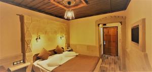 Postel nebo postele na pokoji v ubytování Ciner Hotel