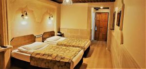 Postel nebo postele na pokoji v ubytování Ciner Hotel