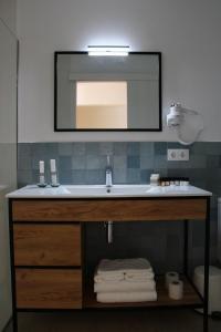 a bathroom with a sink and a mirror at Horta d'en Rahola - Adults Only in Cadaqués
