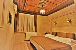 Postel nebo postele na pokoji v ubytování Ciner Hotel