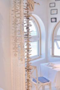 a curtain of wine bottles sitting on top of a chair at AVANTI Lifestyle Hotel - Only Adults in Corralejo