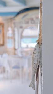 a wooden elephant ornament hanging on a wall at AVANTI Lifestyle Hotel - Only Adults in Corralejo