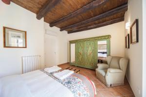 Postel nebo postele na pokoji v ubytování Palazzo Marigliano - Serviced Apartments