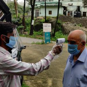 a man taking a picture of another man with a camera at Babbar's Den-An Elegant Homestay in Mount Ābu