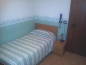 Postel nebo postele na pokoji v ubytování Ristorante Albergo da Giovanni