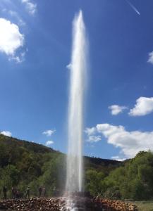 a tall water fountain in the middle of a field at Kleines Glück in Burgbrohl