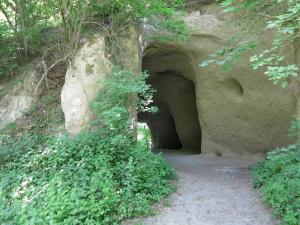 a tunnel in the side of a rock wall at Kleines Glück in Burgbrohl