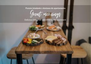 a wooden table with food on top of it at Podhalańskie Tarasy - LoftAffair in Kościelisko +96 photos